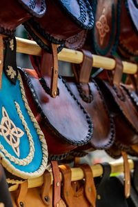 Close-up of slippers hanging in store for sale