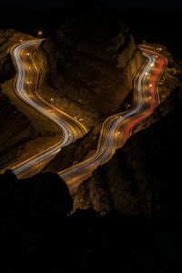 High angle view of light trails on road at night