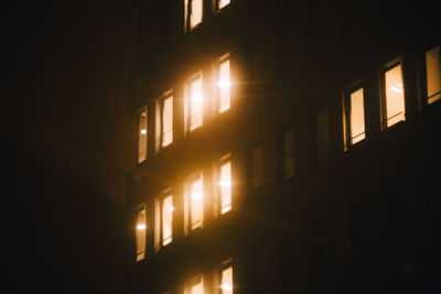 Low angle view of illuminated building at night