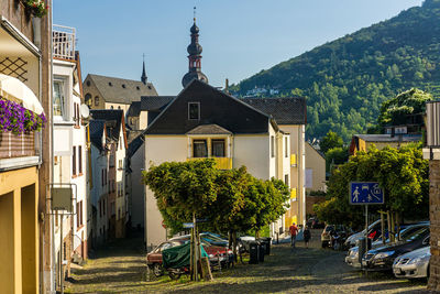 Street amidst buildings in city against sky