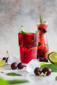 Lemonade or non-alcohol cocktail with cherry and lime