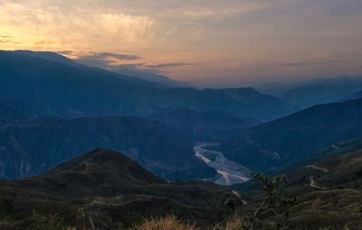 Scenic view of mountains against sky during sunset