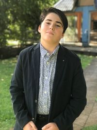 Portrait of young man standing outdoors