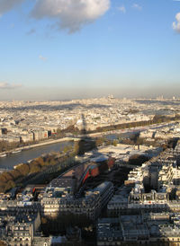 High angle view of city buildings against sky