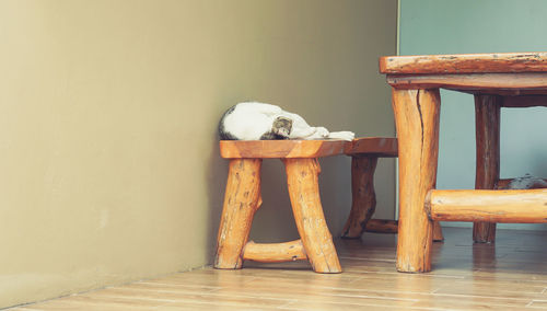 Empty chair and table on hardwood floor