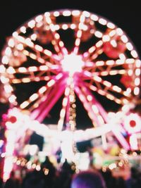 Low angle view of illuminated lights at night