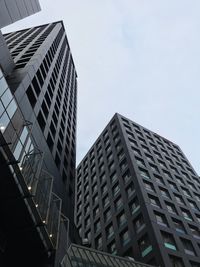 Low angle view of office building against sky