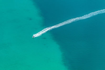 Aerial view of boat moving on sea