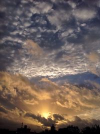 Low angle view of dramatic sky during sunset