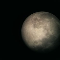 Close-up of moon over black background