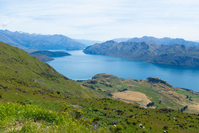 Scenic view of mountains and sea against sky