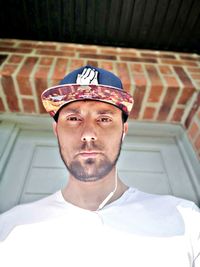 Portrait of young man wearing hat