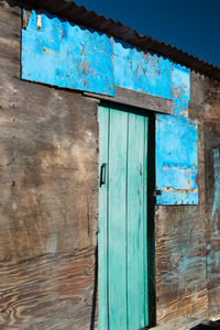 Low angle view of blue door