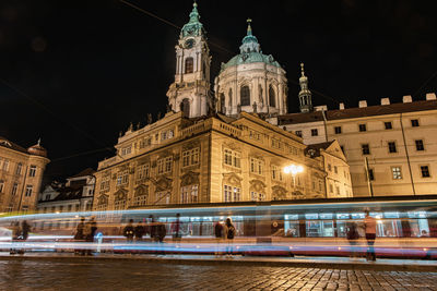 Illuminated buildings in city at night