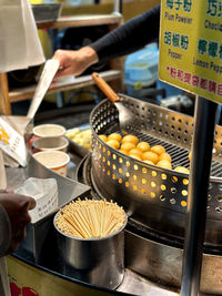 Cropped hand of person preparing food