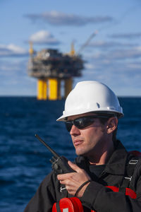 Offshore energy production with person on ship