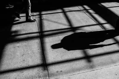 Low section of people standing on tiled floor