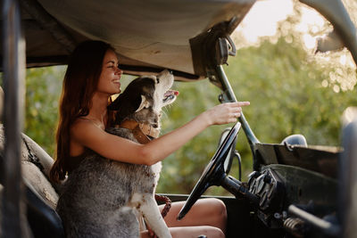 Side view of woman with dog