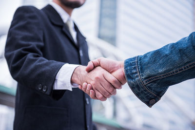 Close-up of business people shaking hands