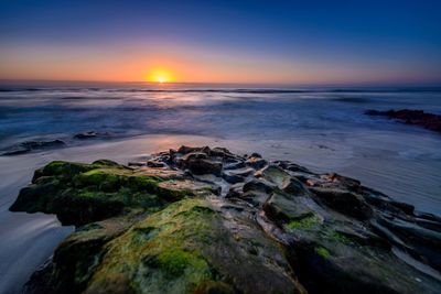 Scenic view of sea against sky during sunset