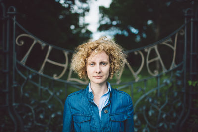 Portrait of young woman standing outdoors