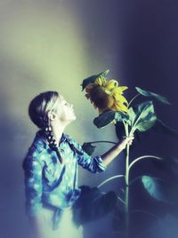 Close-up of woman holding flowers