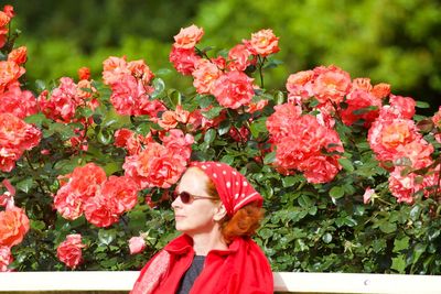 Portrait of woman with pink flowers