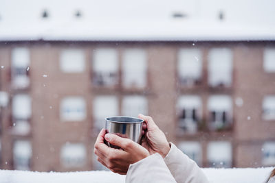 Hand holding coffee cup