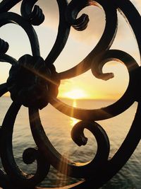 Close-up of sea against sky during sunset