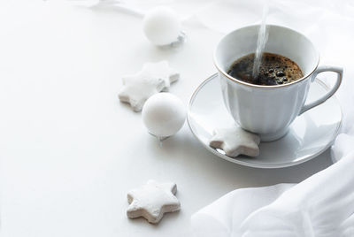 High angle view of coffee cups on table