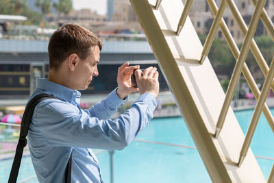 Man photographing with mobile phone