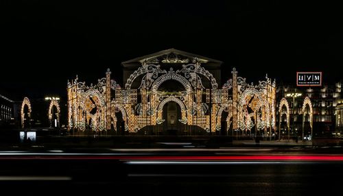 Light trails on road in city at night