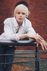 Portrait of woman sitting on bench