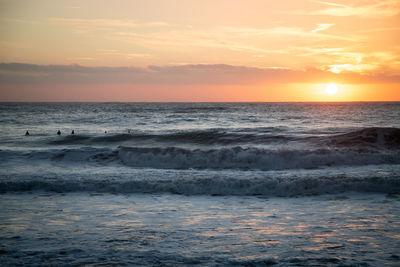 Scenic view of sea against sky during sunset