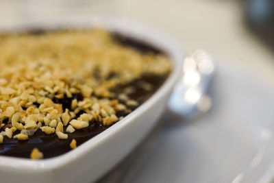 Close-up of coffee beans in bowl on table