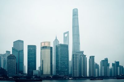 Skyscrapers in city against clear sky