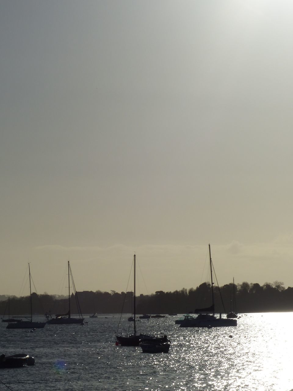 nautical vessel, transportation, mode of transport, water, boat, waterfront, sea, moored, sailing, clear sky, sailboat, nature, tranquility, tranquil scene, copy space, river, sky, beauty in nature, scenics, mast