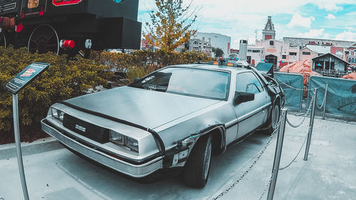 Cars parked on road by building