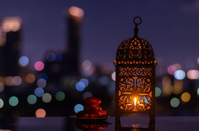 Lantern and small plate of dates fruit  for the muslim feast of the holy month of ramadan kareem.