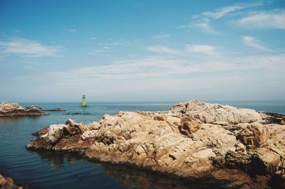 Scenic view of calm sea against sky