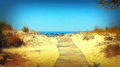 Scenic view of beach against clear sky