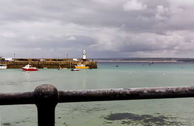 Sailboat on sea against sky