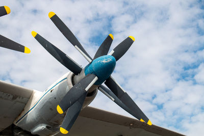 Low angle view of airplane against sky