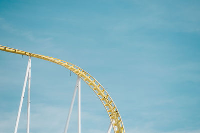 Low angle view of rollercoaster against sky