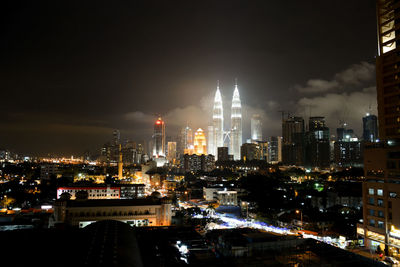 Illuminated buildings in city at night