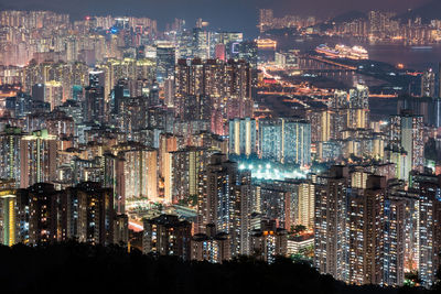 High angle view of illuminated buildings in city at night