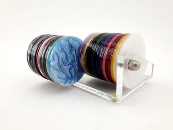 High angle view of multi colored pencils on white background