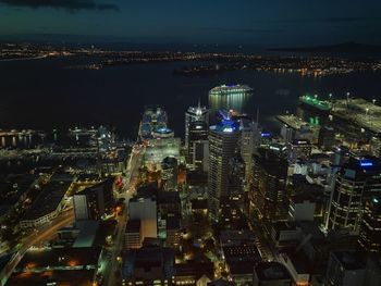 High angle view of illuminated buildings in city at night