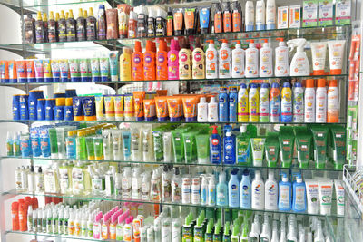 Full frame shot of multi colored bottles in store