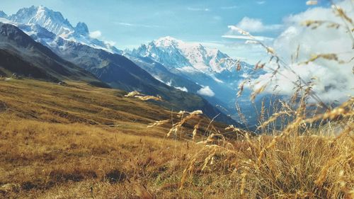 Scenic view of snowcapped mountains against sky